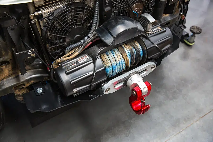 Car winch installation with frame reinforcement